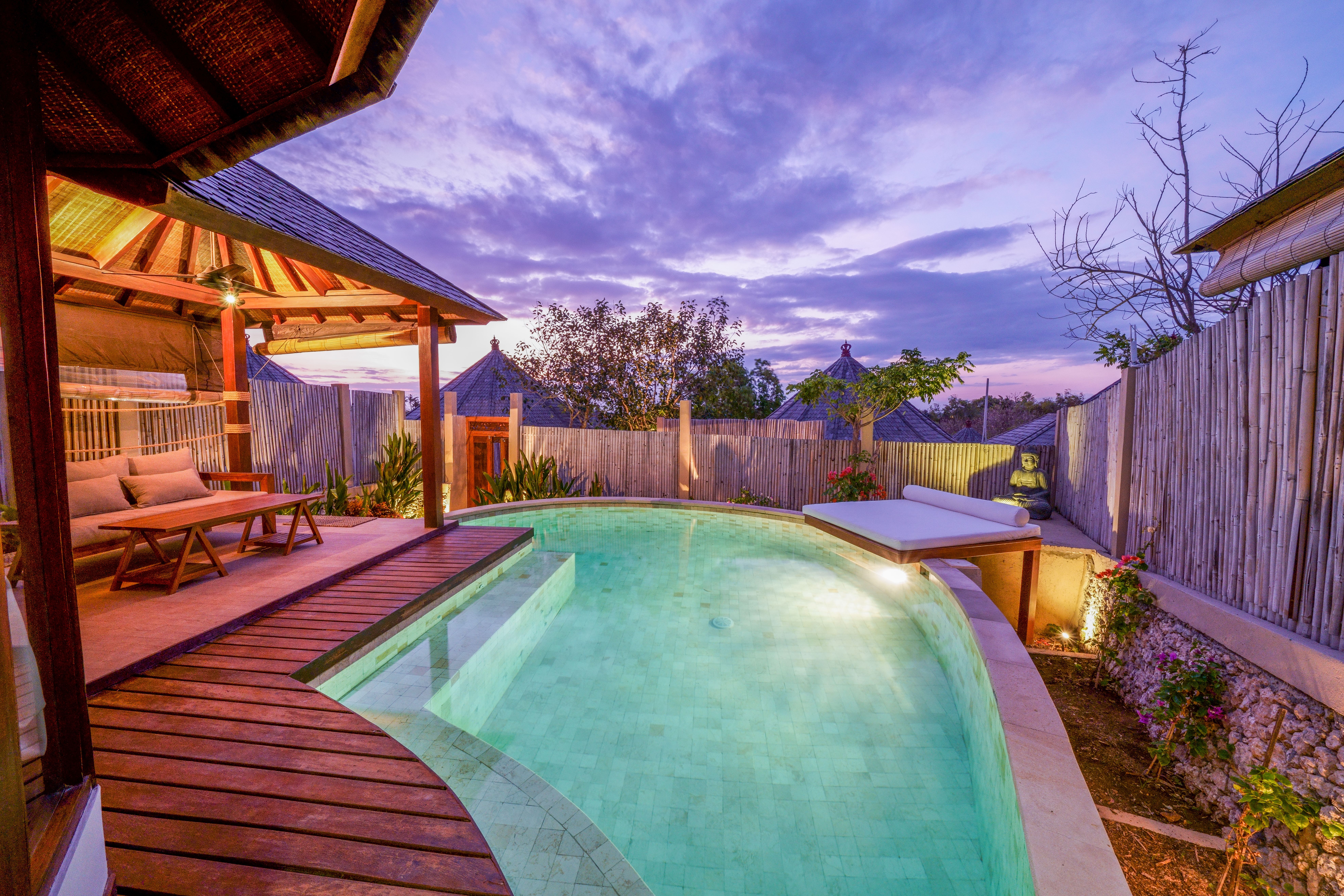 Private villa pool at sunset